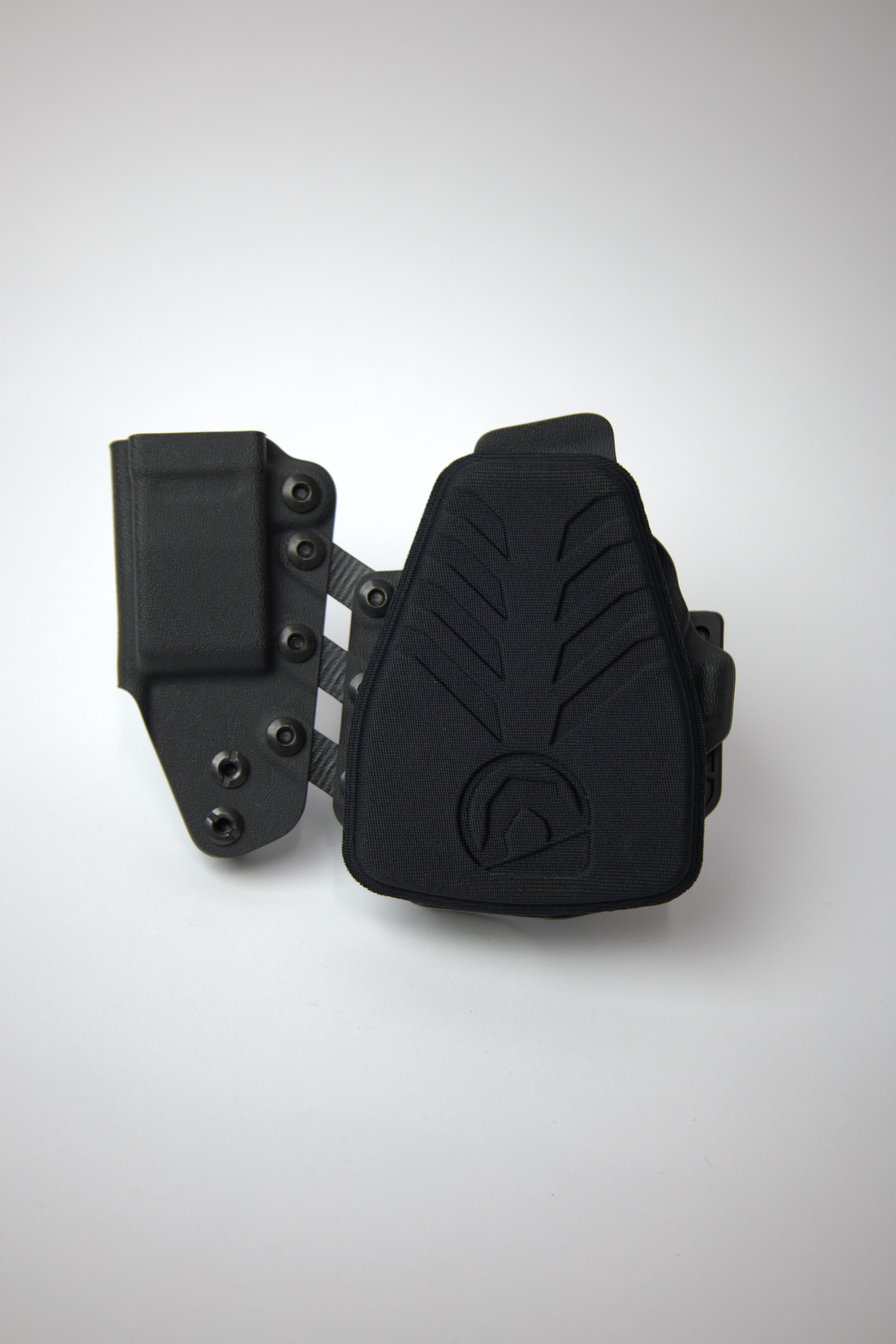 Black tactical holster on a white background with Plateau Holster pad