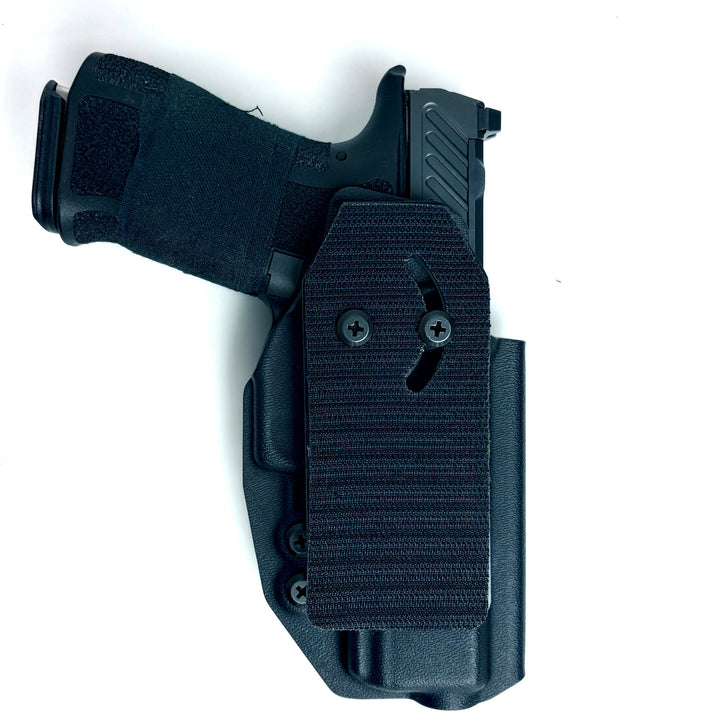 Black gun holster with a gun inside on a white background