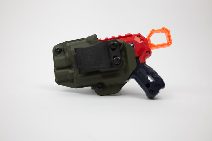 Toy gun with green holster, red and black body, and orange scope on a white background