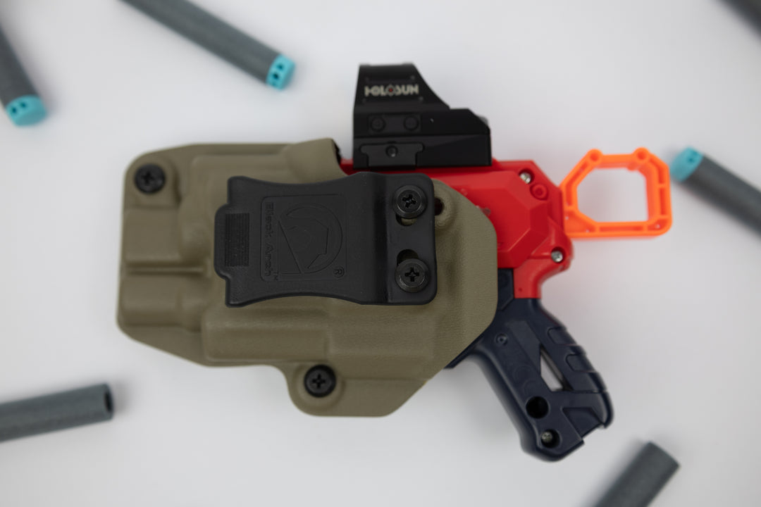 Weapon with a red grip and black accents on a white background