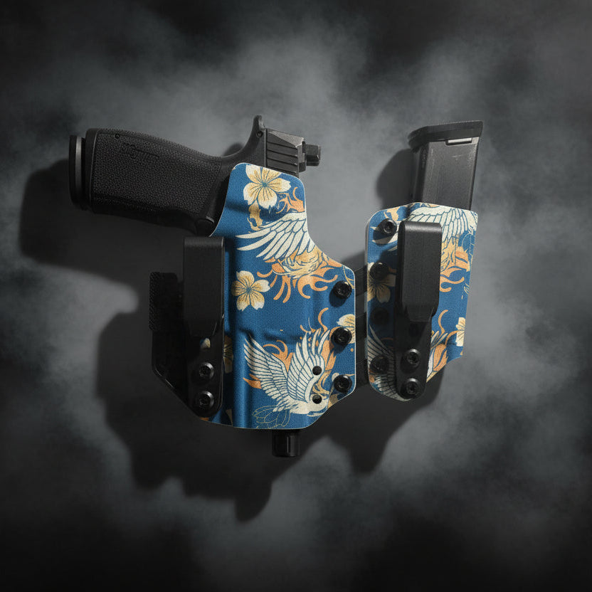Glock handgun with floral-patterned magazine on a white background