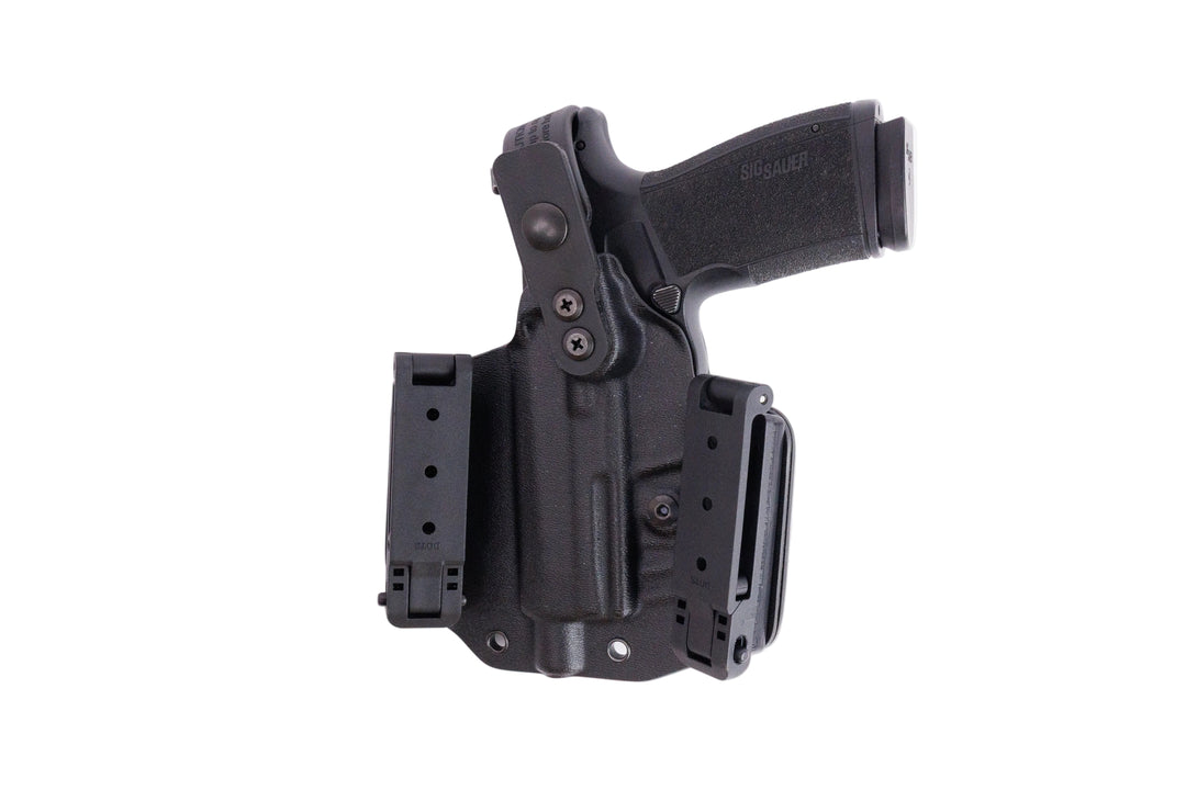 Black gun holster with magazine on a white background