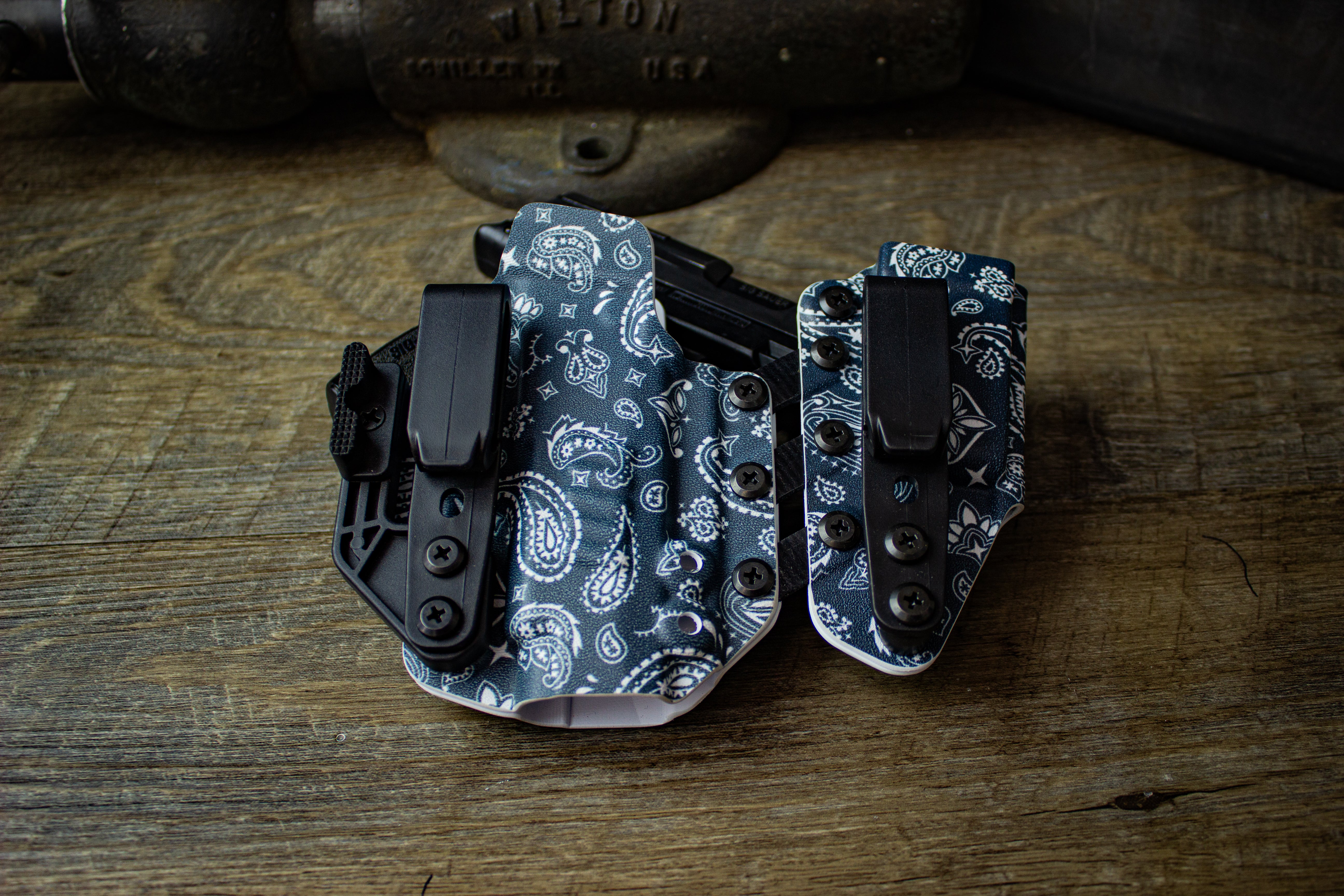 Right-handed Entrada holster for Sig P365 XL in April 2025 Holster of the Month Paisley print. Shown with ModWing and Griphook belt clips.1