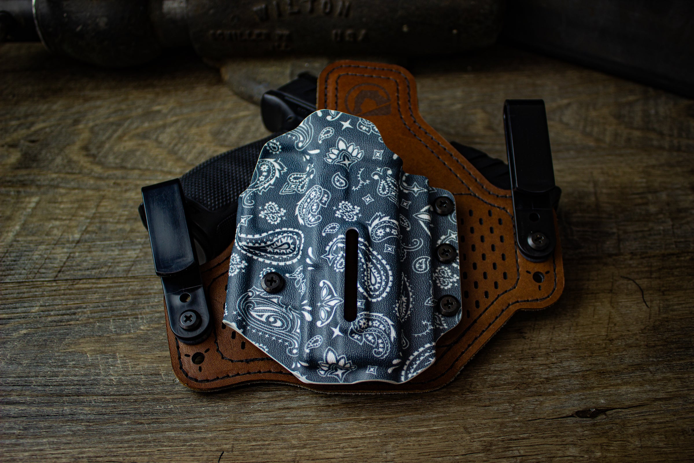 Dual Clip Protos-M holster for Walther PDP 4" in right-handed configuration, April 2025 Paisley Holster of the Month print. Shown with polymer belt clips and breathable leather backer.