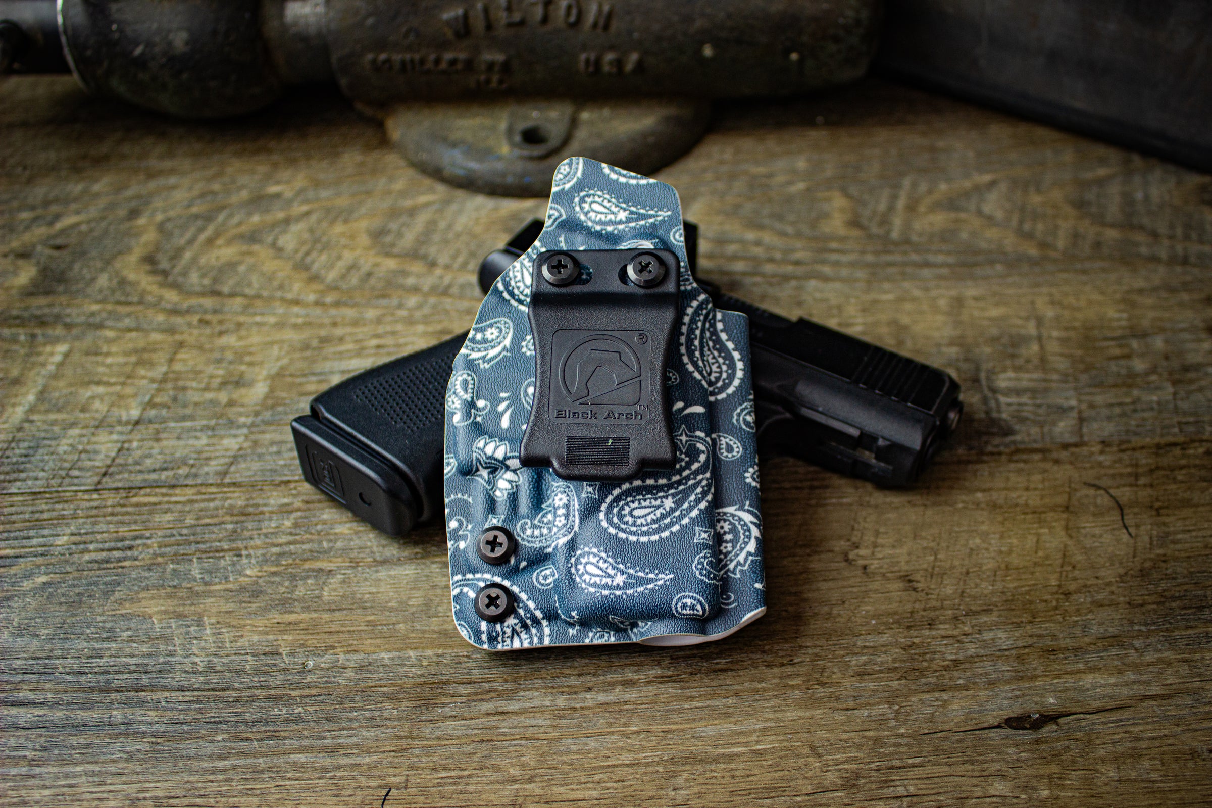 Right-handed Rev-Con holster for Glock 43X MOS in April 2025 Paisley print. Shown with single Foamy Clip.